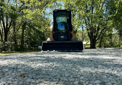 Caterpillar compact track loader gravel path